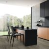 York Grey Luxury Vinyl Floor Planks in a minimalist dark kitchen.