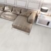 Eden Dolomite Polished Porcelain Tile with a sectional couch.