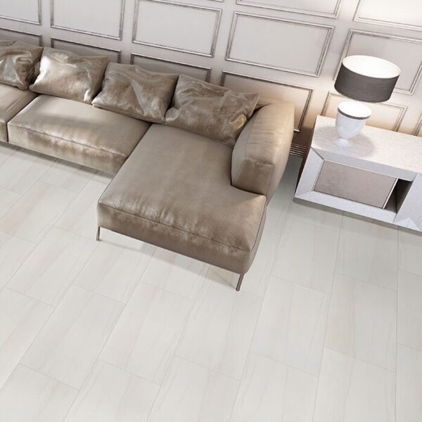 Eden Dolomite Polished Porcelain Tile with a sectional couch.
