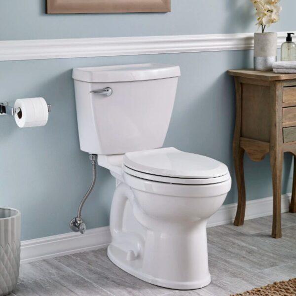American Standard Champion IV All-in-One 1.28GPF Elongated Toilet in a blue bathroom
